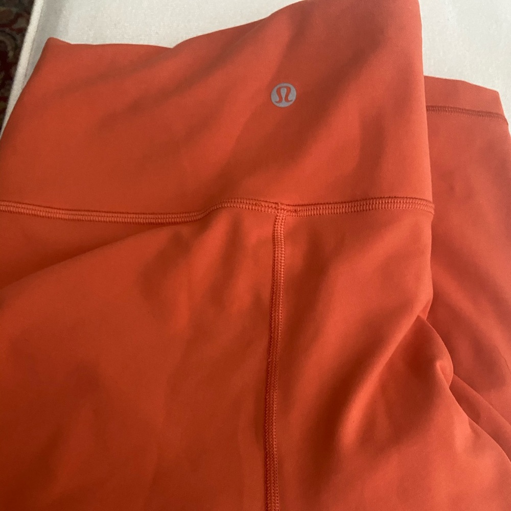 Orange Lululemon Wunder Under 25’ Leggings